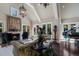 Sophisticated living room with high ceilings, a fireplace, elegant decor, and access to a pool at 1829 Bougainvillea St, Sarasota, FL 34239