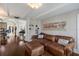 Comfortable living room features hardwood floors, a large leather couch with ottoman, and built-in shelving at 1829 Bougainvillea St, Sarasota, FL 34239