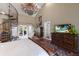 Light-filled main bedroom with a spiral staircase, balcony access, and a seating area at 1829 Bougainvillea St, Sarasota, FL 34239