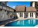 Inviting pool with stone surround, exterior view of home, and well-manicured landscape at 1829 Bougainvillea St, Sarasota, FL 34239