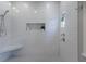 Modern shower with white subway tile, built-in niche, and glass door at 1829 Bougainvillea St, Sarasota, FL 34239