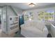 Cozy sitting area with natural light, built-in shelving, and comfortable seating at 1829 Bougainvillea St, Sarasota, FL 34239