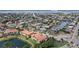 High-angle aerial image capturing waterfront condo complex in coastal community with nearby canal access at 197 Tropicana Dr # 1511, Punta Gorda, FL 33950