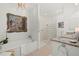 Bright bathroom featuring a soaking tub, glass block shower, granite vanity, and artwork for a spa-like ambiance at 197 Tropicana Dr # 1511, Punta Gorda, FL 33950