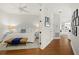 Calm primary bedroom featuring neutral decor, hardwood floors, and opening to a bright hallway at 197 Tropicana Dr # 1511, Punta Gorda, FL 33950