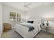 Calm bedroom with a ceiling fan, a plush bed, and natural light streaming through the window at 197 Tropicana Dr # 1511, Punta Gorda, FL 33950