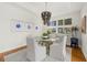 Bright dining area with a glass table, elegant chandelier and a view of the outdoors at 197 Tropicana Dr # 1511, Punta Gorda, FL 33950