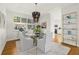 Dining area featuring modern furniture, a unique chandelier, and a stylish display shelf at 197 Tropicana Dr # 1511, Punta Gorda, FL 33950