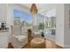 Sunny kitchen nook with comfortable seating near a sliding door leading to the patio at 197 Tropicana Dr # 1511, Punta Gorda, FL 33950