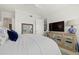 Comfortable bedroom featuring a large TV, ceiling fan, and an ornate, mirrored console table at 197 Tropicana Dr # 1511, Punta Gorda, FL 33950