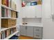 Well-organized storage space with white and gray cabinets, shelves, and a marble-look countertop at 197 Tropicana Dr # 1511, Punta Gorda, FL 33950
