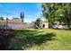 Spacious backyard featuring a playset, storage shed, and well-maintained lawn at 2238 Rose St, Sarasota, FL 34239