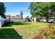 Spacious backyard featuring a playset, storage shed, and well-maintained lawn at 2238 Rose St, Sarasota, FL 34239