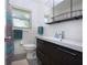 Bathroom with modern vanity, colorful shower curtain, and updated fixtures at 2238 Rose St, Sarasota, FL 34239