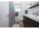 Nicely updated bathroom featuring vanity, decorative shower curtain, and modern fixtures at 2238 Rose St, Sarasota, FL 34239