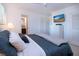 Bright bedroom features a TV, fresh white paint, and terrazzo flooring at 2238 Rose St, Sarasota, FL 34239