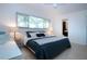 Bedroom featuring neutral walls, large window and comfortable bedding at 2238 Rose St, Sarasota, FL 34239