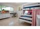 Cozy ' bedroom with whimsical decor, comfortable bunk bed, and lots of natural light at 2238 Rose St, Sarasota, FL 34239