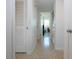 Hallway featuring tile flooring, closet doors and views to the bedroom at 2238 Rose St, Sarasota, FL 34239