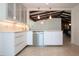 Stylish kitchen with stainless steel appliances, white cabinets, and sleek countertops at 2238 Rose St, Sarasota, FL 34239
