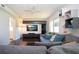 Comfortable living room with a gray sectional sofa and modern entertainment center at 2238 Rose St, Sarasota, FL 34239