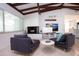 Inviting living room offering a fireplace, tv and beamed ceilings at 2238 Rose St, Sarasota, FL 34239