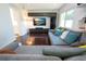 Cozy living room with dark wood floors and a large sectional sofa at 2238 Rose St, Sarasota, FL 34239