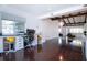 Open-concept layout showing an office area connected to a living room with exposed beams at 2238 Rose St, Sarasota, FL 34239
