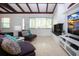 Comfortable living room with a decorative fireplace, beamed ceiling, and bright, airy feel at 2238 Rose St, Sarasota, FL 34239