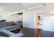 Open-concept living room with dark wood floors and access to the kitchen at 2238 Rose St, Sarasota, FL 34239