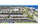 An aerial view of waterfront condominiums with boat docks and a canal leading to the water at 245 Coldeway Dr # B10, Punta Gorda, FL 33950