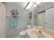 Bright bathroom featuring a shower/tub combo and decorated with beach themed decor at 245 Coldeway Dr # B10, Punta Gorda, FL 33950
