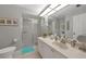 Bright bathroom features a glass enclosed shower, and a vanity with ample countertop space at 245 Coldeway Dr # B10, Punta Gorda, FL 33950