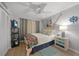 Nicely decorated bedroom featuring nautical decor, a ceiling fan, and ample closet space at 245 Coldeway Dr # B10, Punta Gorda, FL 33950