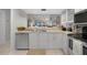 Modern kitchen showcasing stainless steel appliances, white cabinetry, and open layout for easy entertaining at 245 Coldeway Dr # B10, Punta Gorda, FL 33950