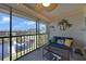 Relaxing screened lanai with waterfront views, comfortable seating, and tropical decor for serene indoor-outdoor living at 245 Coldeway Dr # B10, Punta Gorda, FL 33950