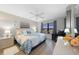 Serene main bedroom with a comfortable bed, soft lighting, and a view of the outdoors at 245 Coldeway Dr # B10, Punta Gorda, FL 33950