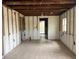 Spacious room with tile flooring and exposed beams, ready for customization and renovation at 29 Michiana Dr, Terra Ceia, FL 34250