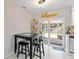 Cozy dining area with a table, chairs, and view of the outdoor living space at 2922 Williamsburg St, Sarasota, FL 34231