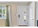 Inviting entryway with a white front door and a light and bright interior at 2922 Williamsburg St, Sarasota, FL 34231