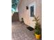 Charming outdoor space featuring lush potted plants, exterior lighting, and a textured wall at 2922 Williamsburg St, Sarasota, FL 34231