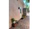 Charming outdoor space with plants, exterior lighting, and textured walls, creating a cozy and inviting atmosphere at 2922 Williamsburg St, Sarasota, FL 34231