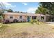 Charming single-story home with a lush front yard and a bright blue front door at 2922 Williamsburg St, Sarasota, FL 34231