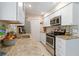 Updated kitchen featuring stainless steel appliances and granite countertops at 2922 Williamsburg St, Sarasota, FL 34231