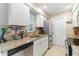 Well-appointed kitchen featuring granite countertops, stainless steel appliances, and white cabinetry at 2922 Williamsburg St, Sarasota, FL 34231