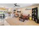 Cozy living room with a ceiling fan, warm earth-tone rug, and comfortable leather sofa at 2922 Williamsburg St, Sarasota, FL 34231