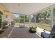 Inviting screened patio with checkered flooring, ideal for relaxation and outdoor enjoyment at 2922 Williamsburg St, Sarasota, FL 34231