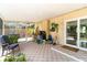 Spacious screened-in lanai, offering versatile space for relaxing with patio furniture and enjoying the outdoors at 2922 Williamsburg St, Sarasota, FL 34231