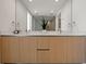 Modern bathroom with a double vanity, sleek lighting, and open layout at 301 Quay Commons # 1204, Sarasota, FL 34236