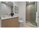 Stylish bathroom with sleek vanity, modern fixtures, and a glass-enclosed shower, creating a serene atmosphere at 301 Quay Commons # 1204, Sarasota, FL 34236
